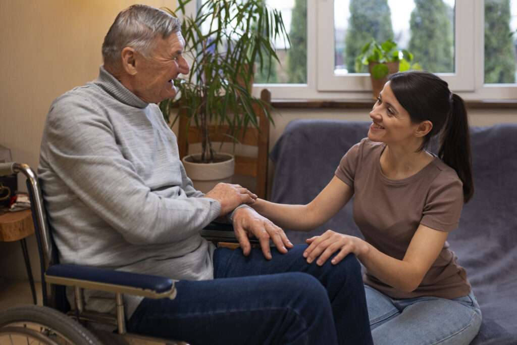 elderly person being taken care by female caretaker (1)